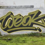 WEOK DESIGN DENNIS PAUL in Berlin - Graffiti-Logo auf Backsteinwand _Weok_